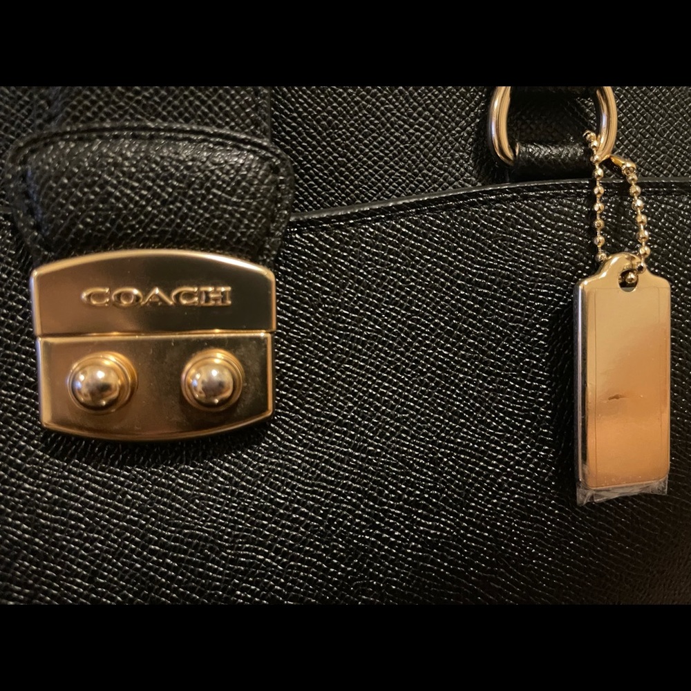 Coach tote black 13 inches in length.